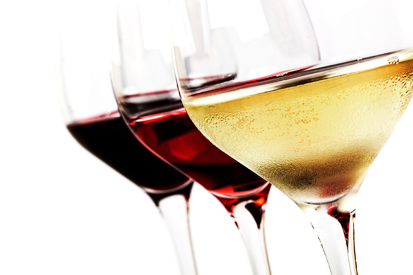 Three wine glasses over white background. White wine, rose, and red.